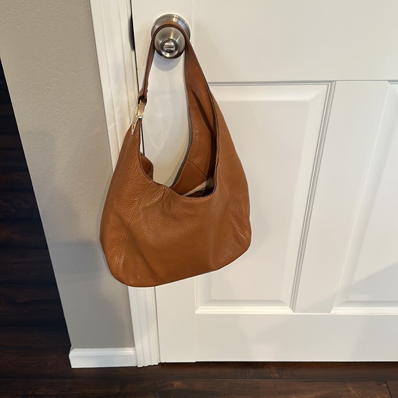 Michael Kors tan leather purse. Gold emblem. Gently used
Snap closure dust bag - Picture 7 of 9